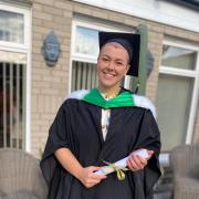 Alva's rugby star Megan Kennedy with her masters degree