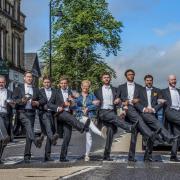 Bridge of Allan resident Christine Cameron with the National Lottery butlers