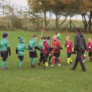 Young players at Bannockburn Rugby Club shake hands with their opponents