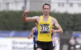 FINISHING LINE: Ali Hay celebrates as he wins the Scottish 5000m title. Pictured by Bobby Gavin