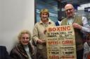 GROWING COLLECTION: Isobel and Jean Speirs deliver more memorabilia relating to Tommy with project officer Ian Mackintosh showcasing a poster advertising a night of bouts at Alloa Town Hall