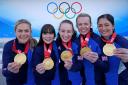 Great Britain's Mili Smith, Hailey Duff, Jennifer Dodds, Vicky Wright and Eve Muirhead celebrate with the gold medal after victory in the Women's Gold Medal Game against Japan during day sixteen of the Beijing 2022 Winter Olympic Games at the