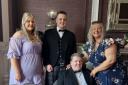 FUNDRAISER: Michael Dobbie (seated) suffered a stroke in 2021.
