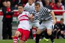 Stirling Albion captain Willie Robertson in action against Queen's Park