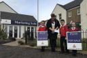Persimmon Homes East Scotland sales executive Sharon Thomson hands a donation over to pupils from East Plean Primary School and Nursery