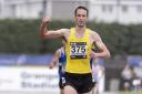 FINISHING LINE: Ali Hay celebrates as he wins the Scottish 5000m title. Pictured by Bobby Gavin