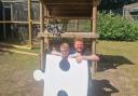 Mylo and his dad Matthew pose with the giant puzzle piece found at Blair Drummond Safari park