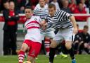 Stirling Albion captain Willie Robertson in action against Queen's Park